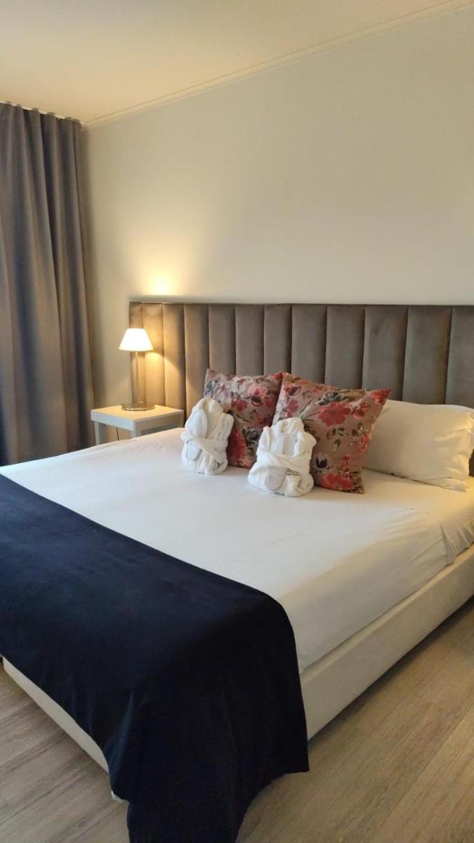 Uma cama ou camas num quarto em Hotel de Ilhavo Plaza & Spa