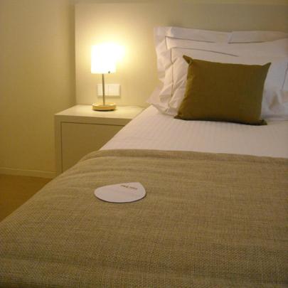 Uma cama ou camas num quarto em INLIMA Hotel & Spa