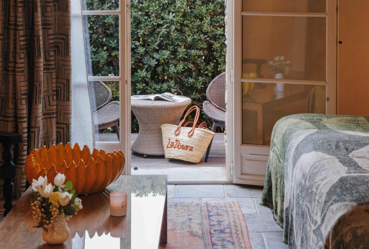 Coin salon dans l'établissement Hôtel La Dimora & Spa