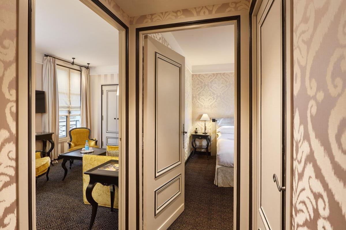 Un ou plusieurs lits dans un hébergement de l'établissement Le Pavillon de la Reine & Spa, Place des Vosges