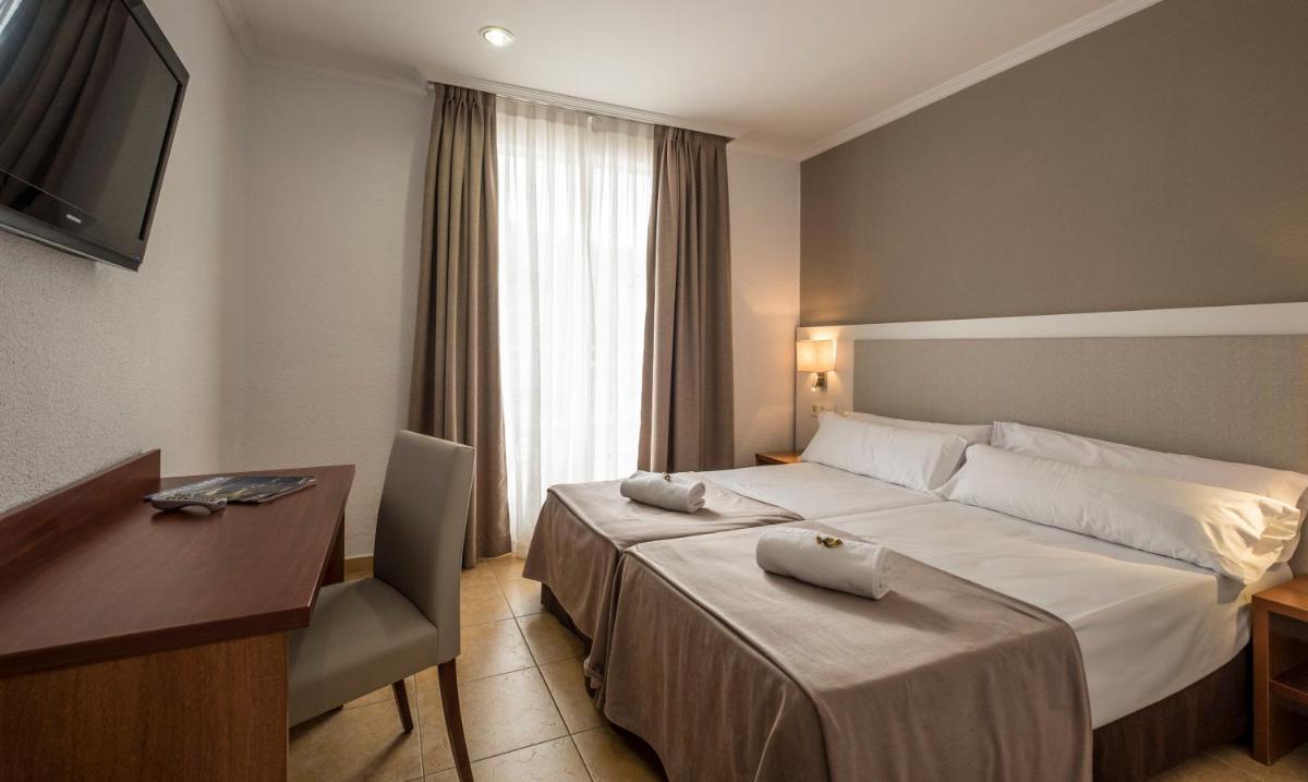 Cama o camas de una habitación en Rosamar & Spa 4*s