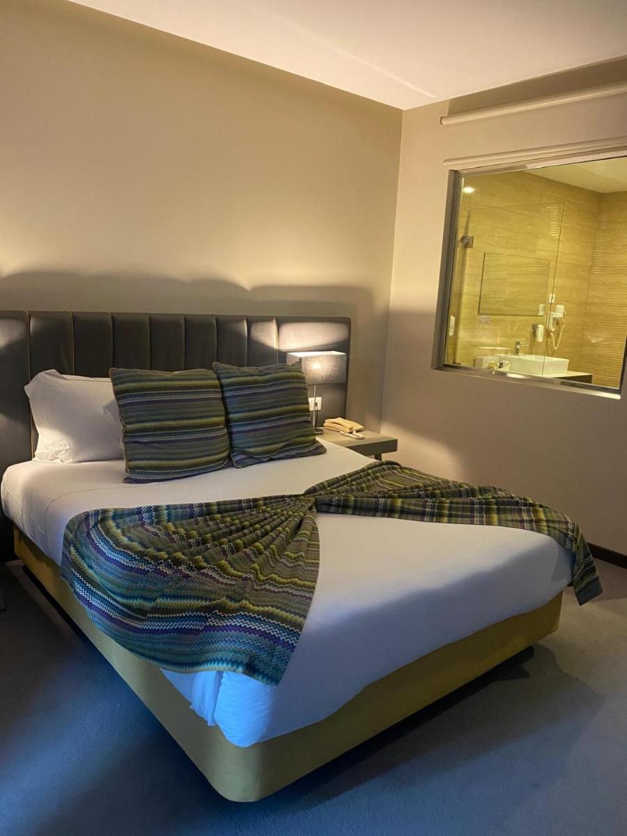 Uma cama ou camas num quarto em Hotel de Ilhavo Plaza & Spa