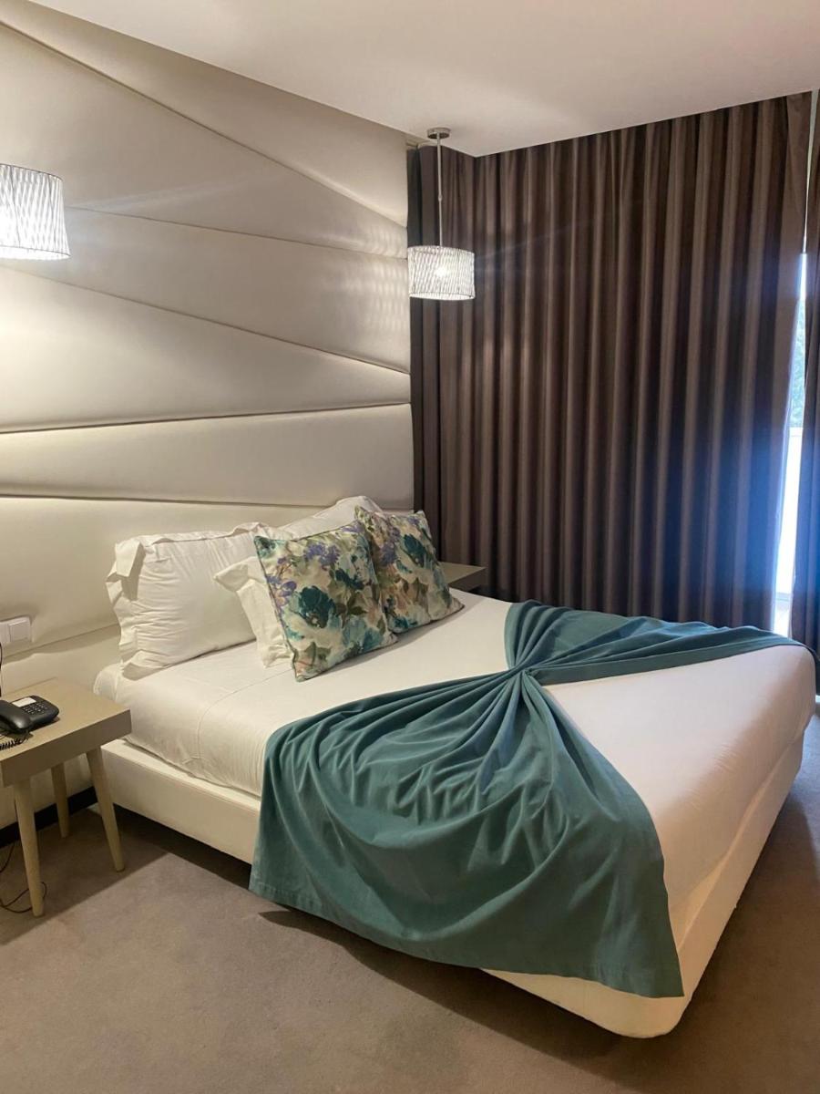 Uma cama ou camas num quarto em Hotel de Ilhavo Plaza & Spa