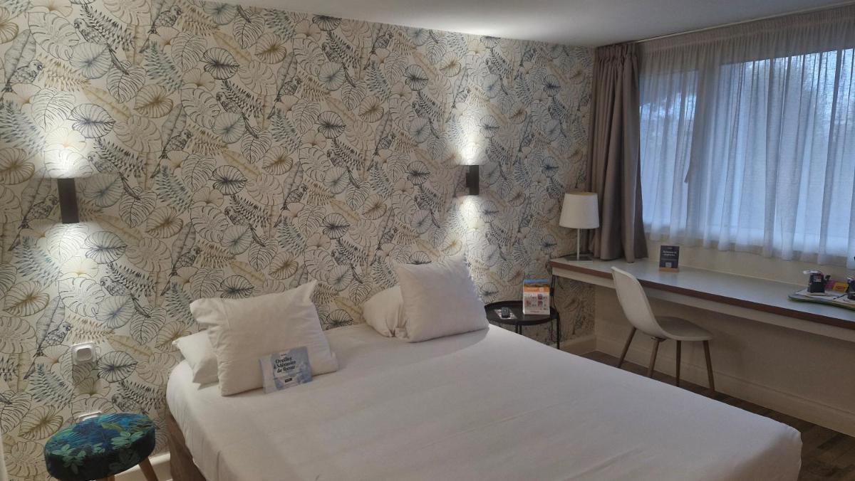 Un ou plusieurs lits dans un hébergement de l'établissement Kyriad Carcassonne - Aéroport