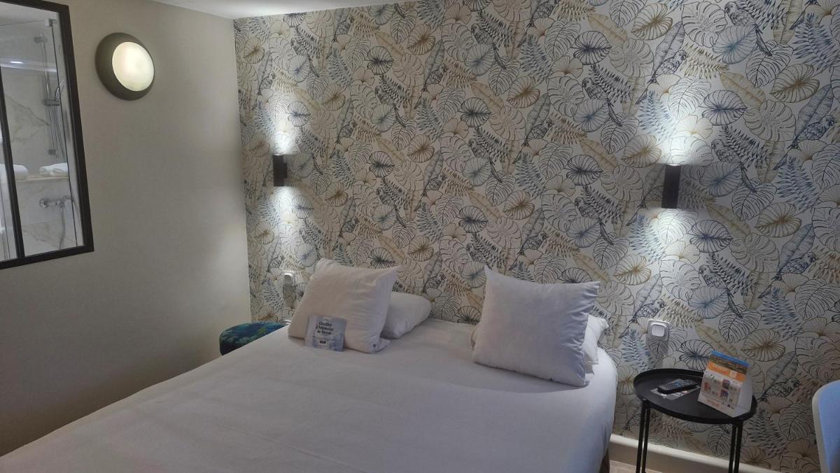 Un ou plusieurs lits dans un hébergement de l'établissement Kyriad Carcassonne - Aéroport