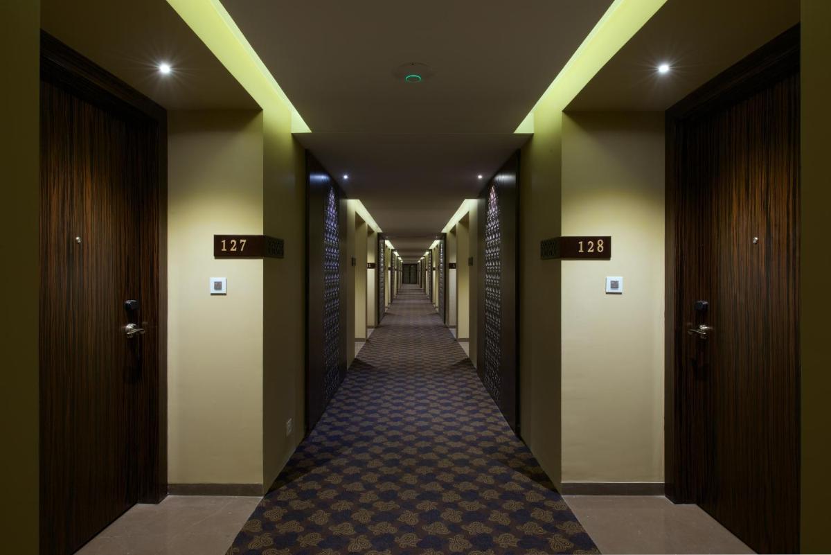 a hallway of a hotel with a long corridor at Hotel Lakend in Udaipur