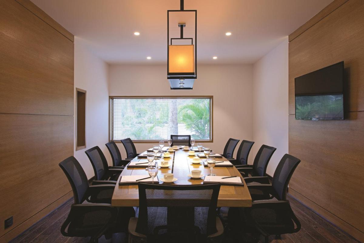 a large conference room with a long table and chairs at Hotel Lakend in Udaipur