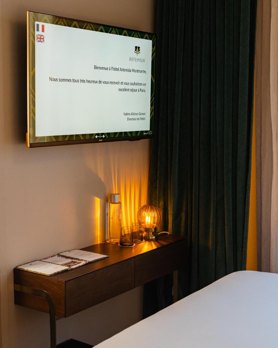 Un ou plusieurs lits dans un hébergement de l'établissement Hôtel Artemisia Montmartre