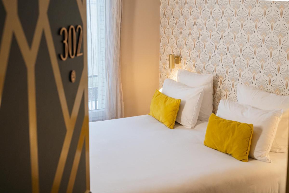 Un ou plusieurs lits dans un hébergement de l'établissement Hôtel Artemisia Montmartre