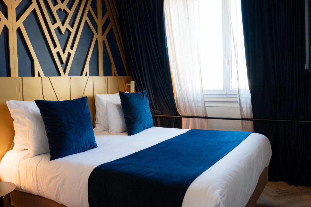 Un ou plusieurs lits dans un hébergement de l'établissement Hôtel Artemisia Montmartre