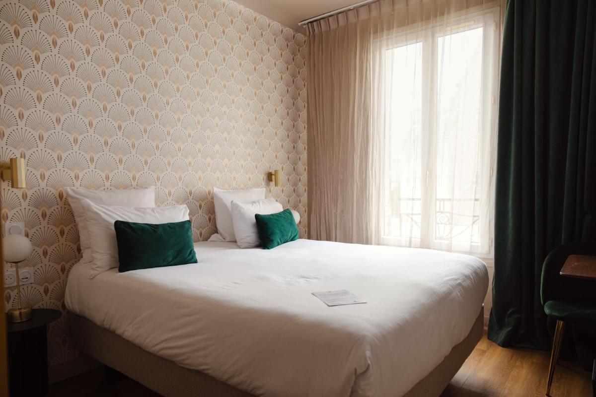 Un ou plusieurs lits dans un hébergement de l'établissement Hôtel Artemisia Montmartre
