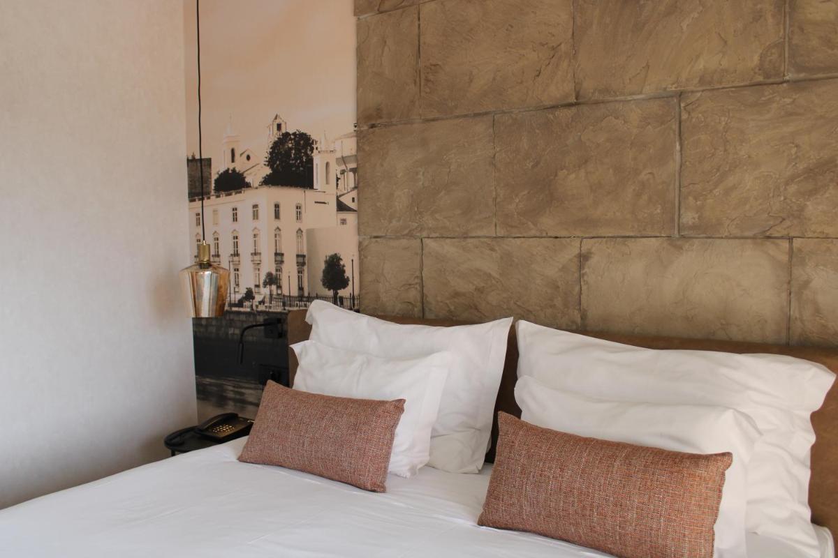 Uma cama ou camas num quarto em AP Maria Nova Lounge - Adults Friendly