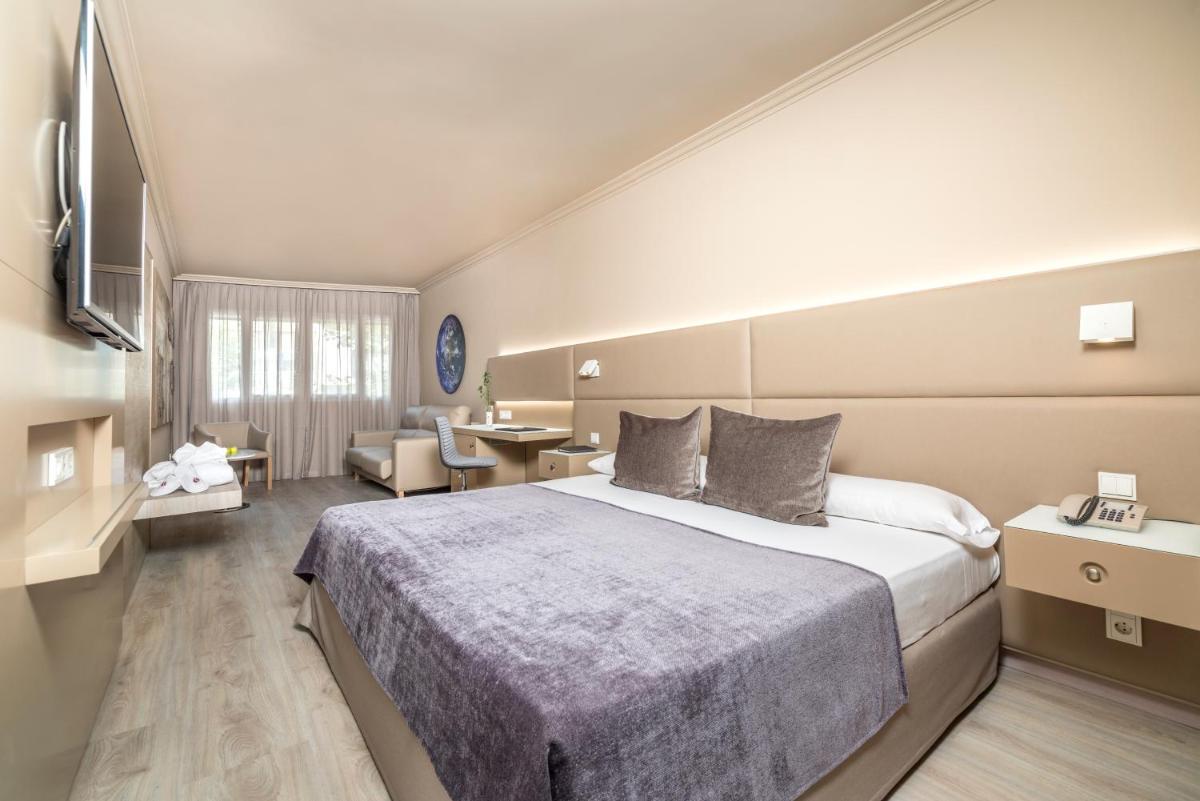 Cama o camas de una habitación en Sallés Hotel Pere IV