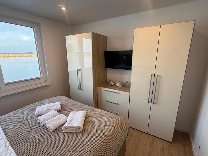 Ein Bett oder Betten in einem Zimmer der Unterkunft Schwimmende Häuser im BALTIC SEA RESORT