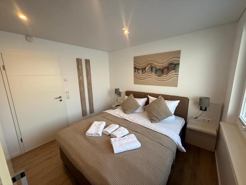 Ein Bett oder Betten in einem Zimmer der Unterkunft Schwimmende Häuser im BALTIC SEA RESORT