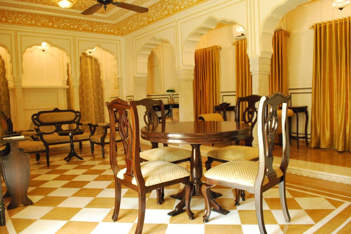 a dining room with a table and chairs at Royal Heritage Haveli - By Leisure Hotels in Jaipur