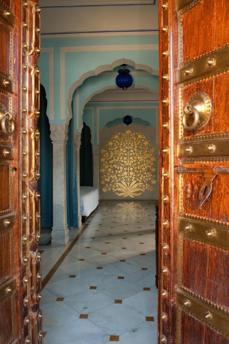 a room with a door and a room with a tile floor at Royal Heritage Haveli - By Leisure Hotels in Jaipur