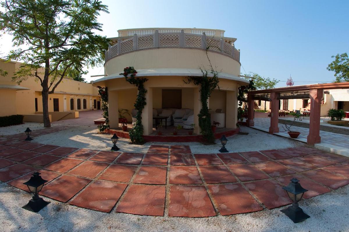 a house with a round patio in the middle at Royal Heritage Haveli - By Leisure Hotels in Jaipur