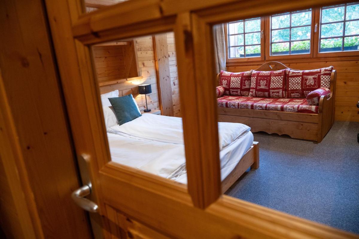 Un ou plusieurs lits dans un hébergement de l'établissement Chalet Hôtel & Spa Le Collet