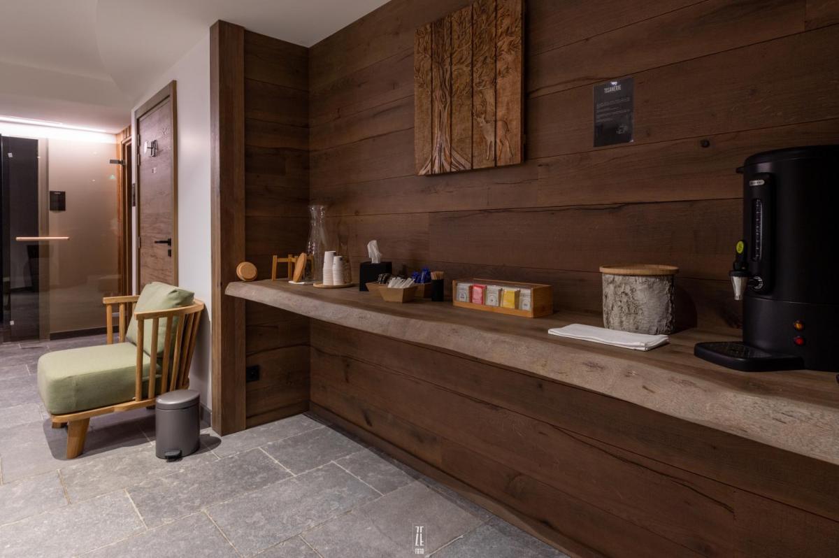 Cuisine ou kitchenette dans l'établissement Chalet Hôtel & Spa Le Collet