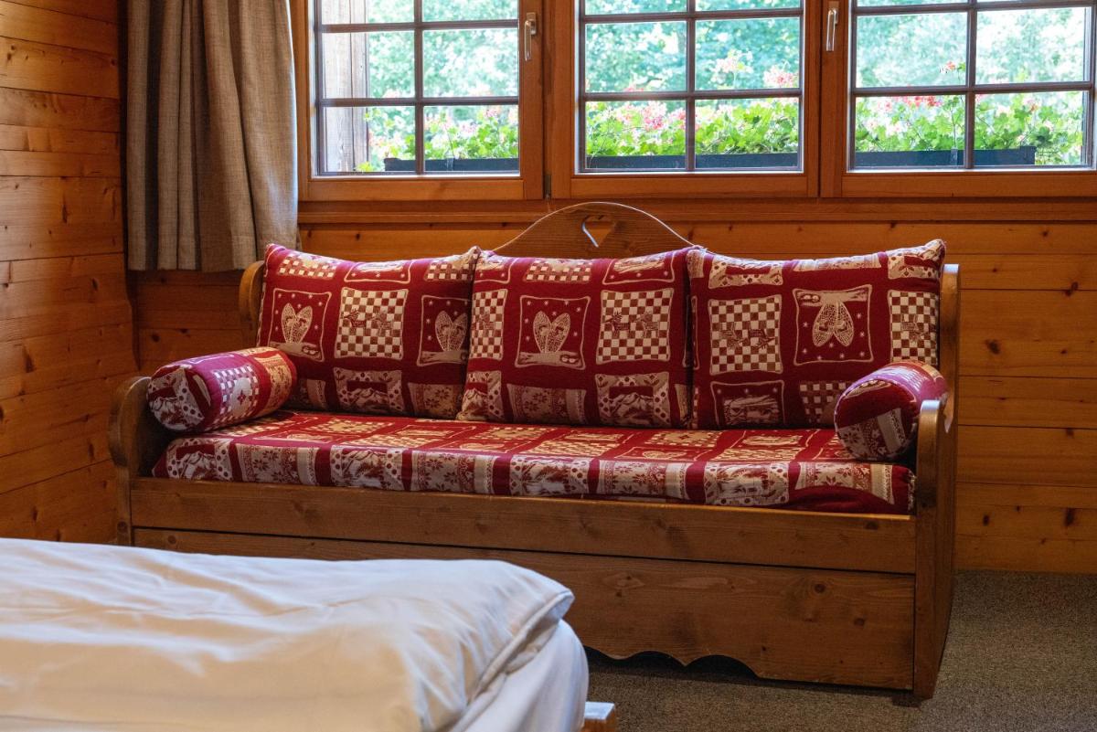 Un ou plusieurs lits dans un hébergement de l'établissement Chalet Hôtel & Spa Le Collet