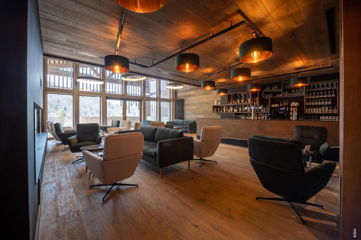 Coin salon dans l'établissement Chalet Hôtel & Spa Le Collet