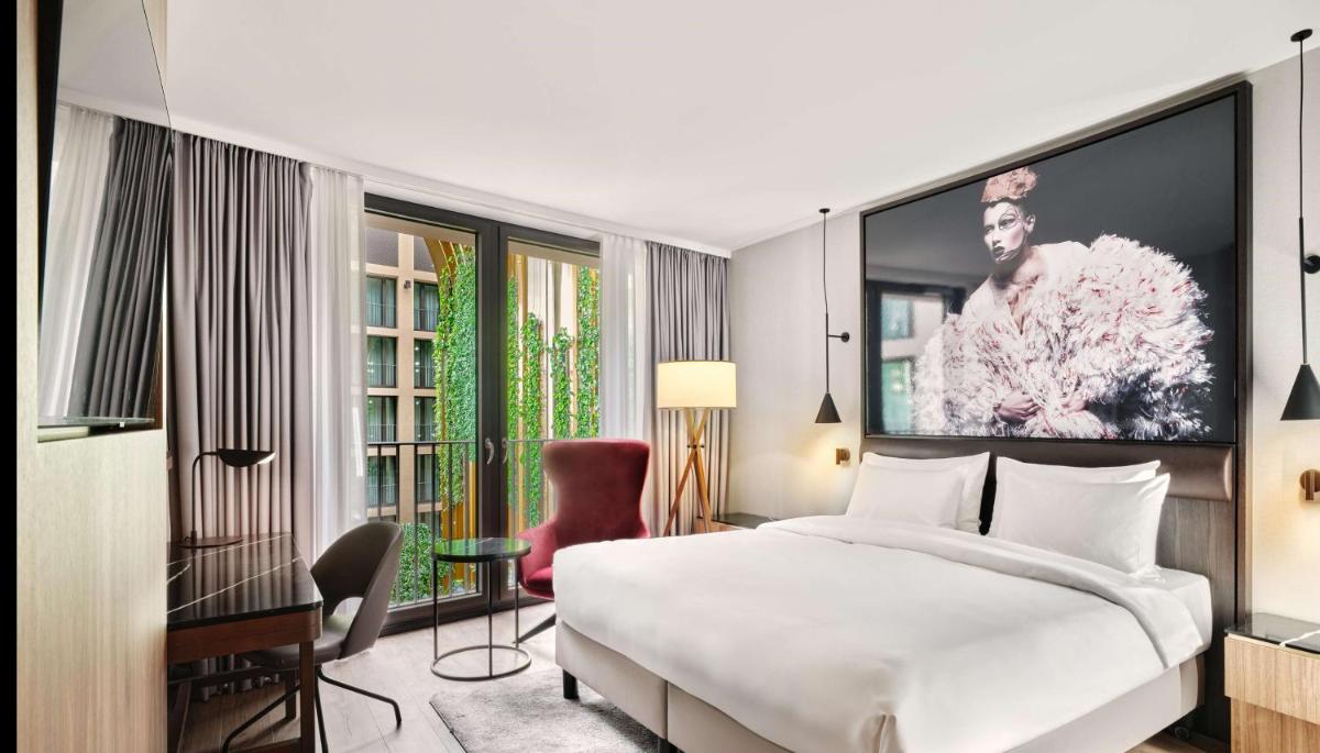 Ein Bett oder Betten in einem Zimmer der Unterkunft Radisson Collection Hotel, Berlin