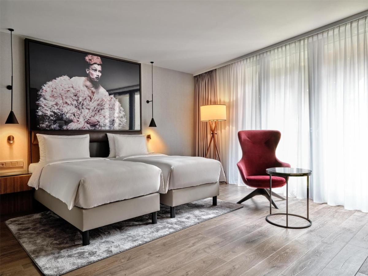 Ein Bett oder Betten in einem Zimmer der Unterkunft Radisson Collection Hotel, Berlin