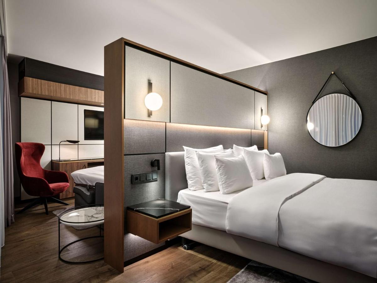 Ein Bett oder Betten in einem Zimmer der Unterkunft Radisson Collection Hotel, Berlin