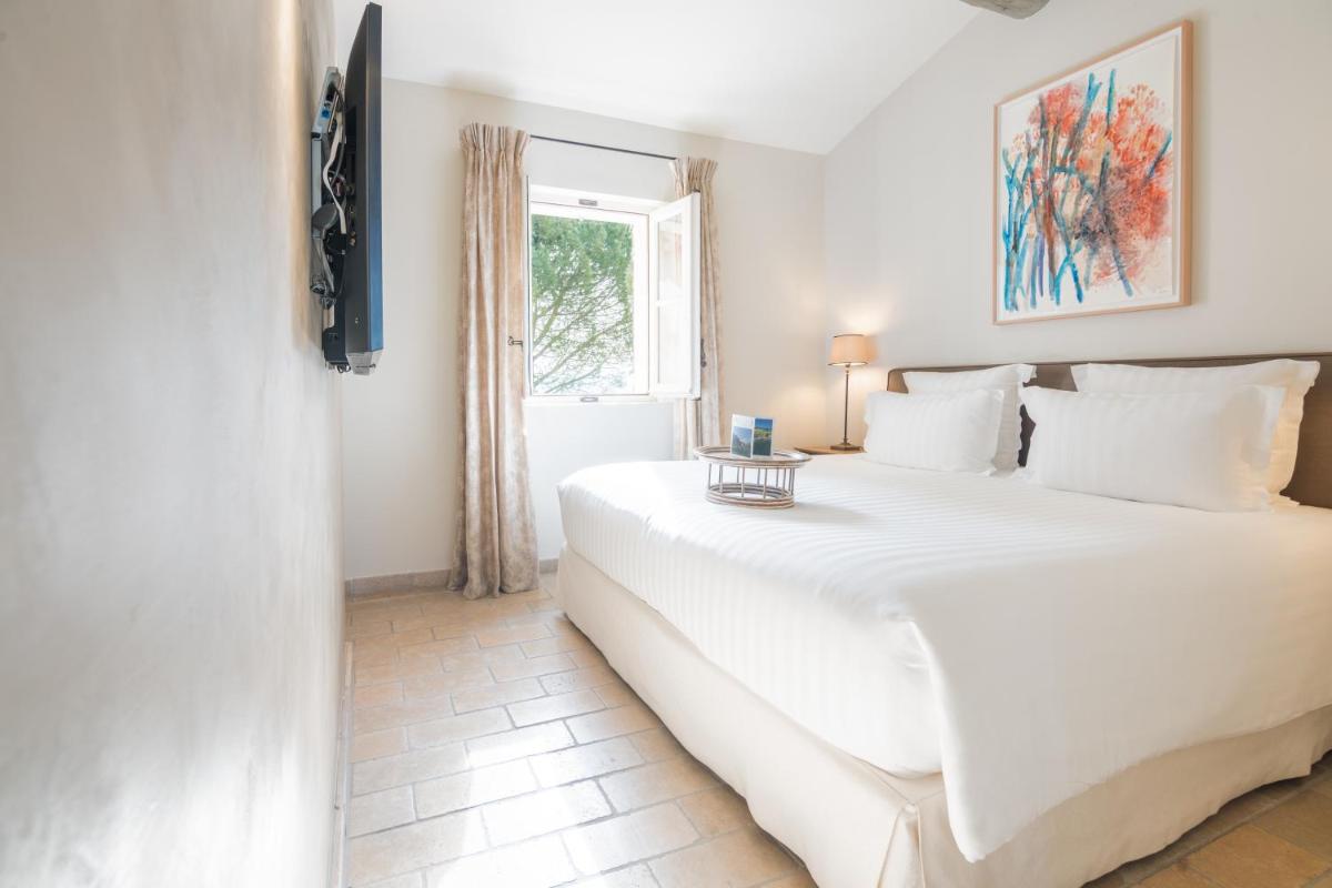Un ou plusieurs lits dans un hébergement de l'établissement Coquillade Provence - Relais & Châteaux