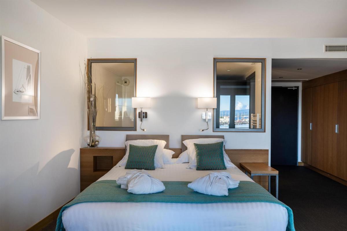 Un ou plusieurs lits dans un hébergement de l'établissement Best Western Premier Hôtel du Vieux-Port