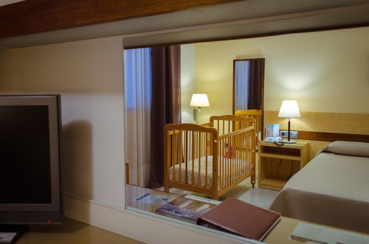 Cama o camas de una habitación en Hotel Mirador de Llerena