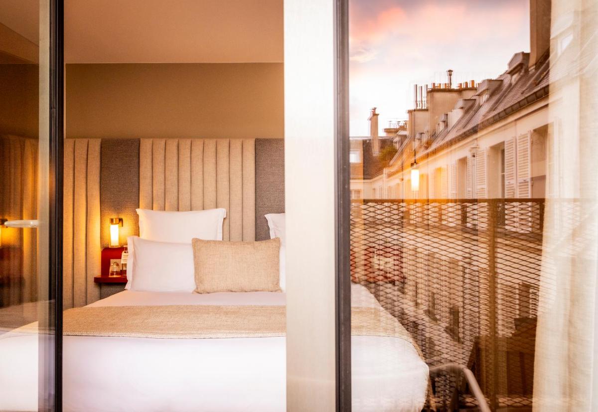 Un ou plusieurs lits dans un hébergement de l'établissement Hôtel Pilgrim