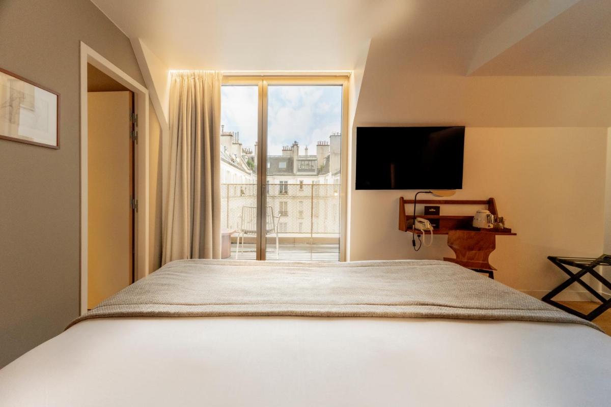 Télévision ou salle de divertissement dans l'établissement Hôtel Pilgrim