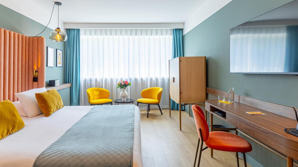 Un ou plusieurs lits dans un hébergement de l'établissement Le Riviera - Hôtel Restaurant & Spa - Ex Golden Tulip Aix les bains