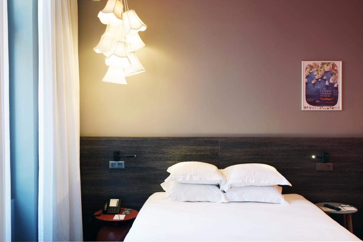 Un ou plusieurs lits dans un hébergement de l'établissement Alex Hotel & Spa