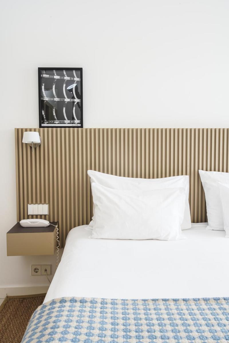 Uma cama ou camas num quarto em Memmo Baleeira - Design Hotels