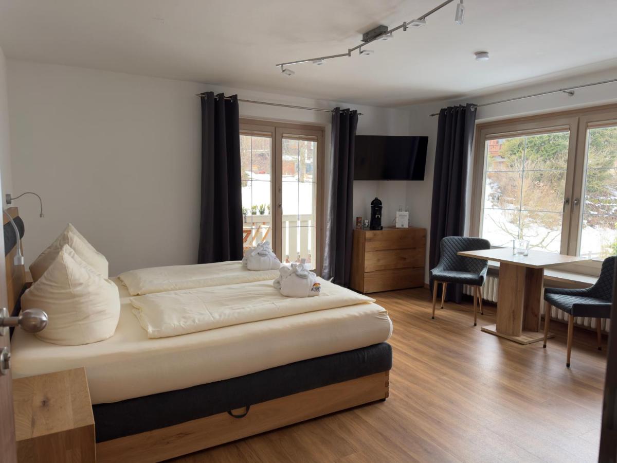 Ein Bett oder Betten in einem Zimmer der Unterkunft Alpenglühn Apartments - Adult Only