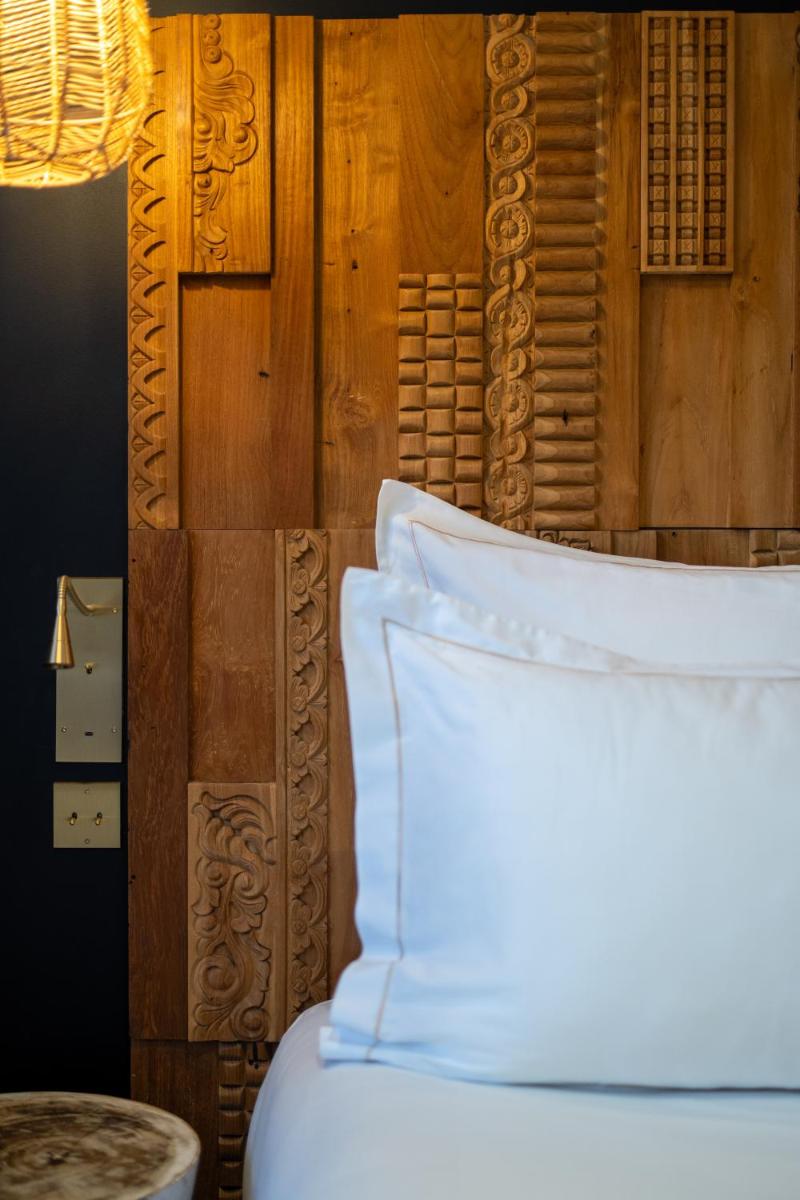 Un ou plusieurs lits dans un hébergement de l'établissement Hôtel Le Saint Remy & Spa