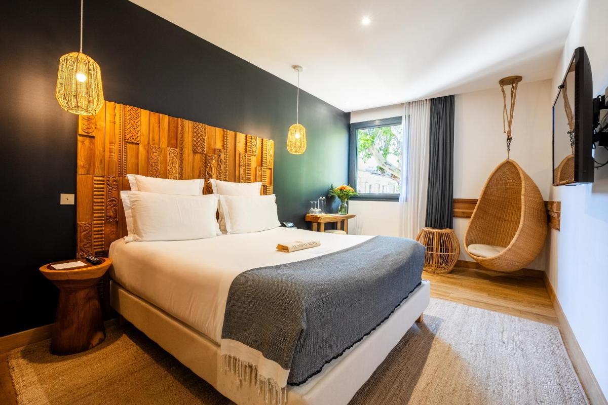 Un ou plusieurs lits dans un hébergement de l'établissement Hôtel Le Saint Remy & Spa