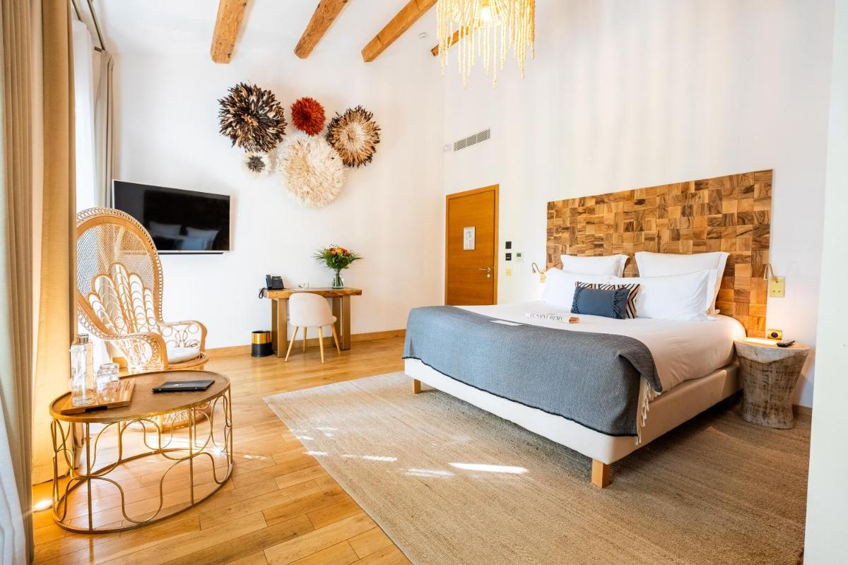 Un ou plusieurs lits dans un hébergement de l'établissement Hôtel Le Saint Remy & Spa