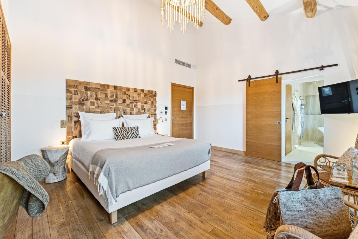 Un ou plusieurs lits dans un hébergement de l'établissement Hôtel Le Saint Remy & Spa