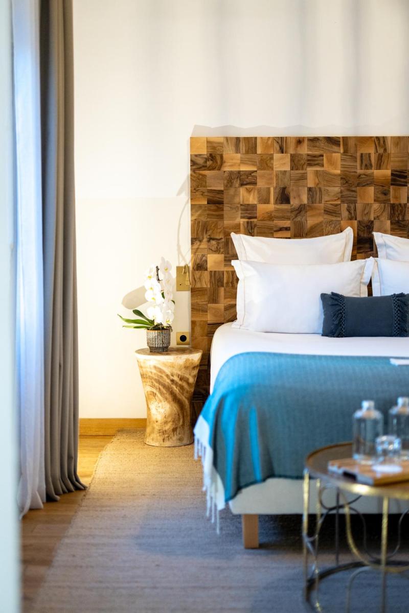 Un ou plusieurs lits dans un hébergement de l'établissement Hôtel Le Saint Remy & Spa