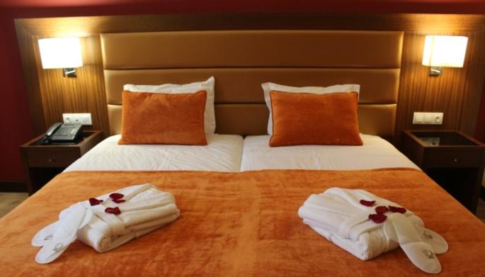 Uma cama ou camas num quarto em Palace Hotel Astúrias & Spa