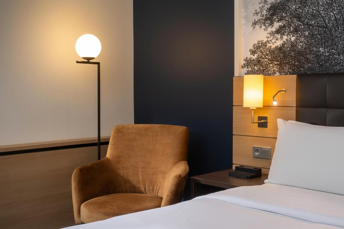 Ein Bett oder Betten in einem Zimmer der Unterkunft Hilton Mainz