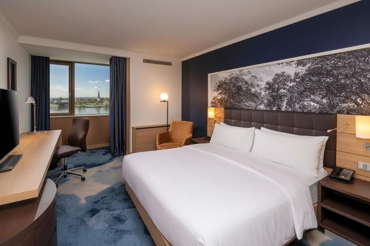 Ein Bett oder Betten in einem Zimmer der Unterkunft Hilton Mainz