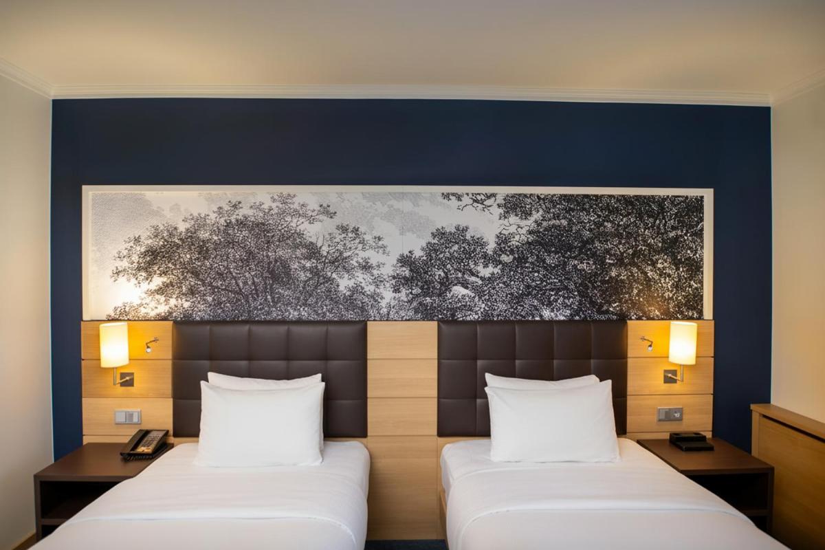 Ein Bett oder Betten in einem Zimmer der Unterkunft Hilton Mainz