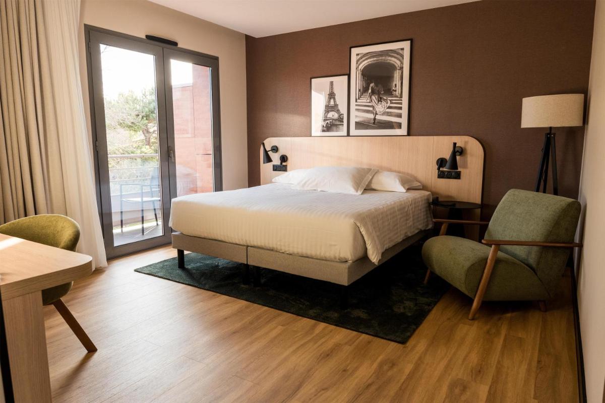 Un ou plusieurs lits dans un hébergement de l'établissement Le Relais de La Malmaison, a member of Radisson Individuals