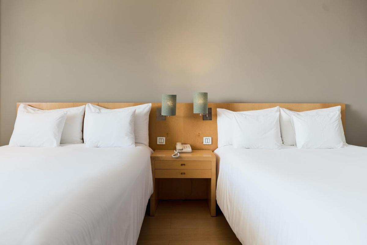 Uma cama ou camas num quarto em The Lince Azores