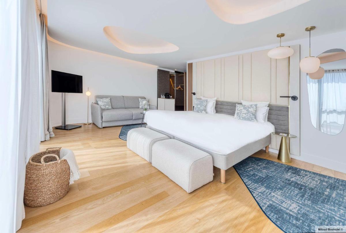 Un ou plusieurs lits dans un hébergement de l'établissement GOLDEN TULIP LYON OUEST TECHLID Hotel & Spa